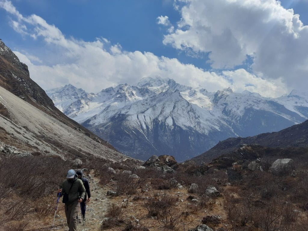 02_Scenic_hike_in_Nepal_s_Langtang_Valley_with_snow_capped_mountains_and_