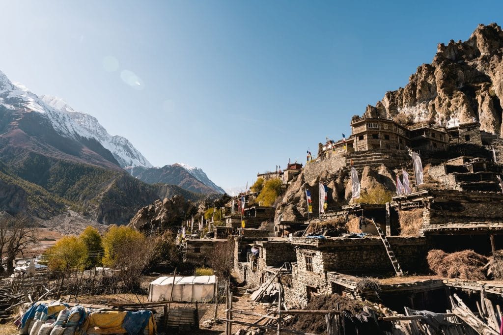 03_A_scenic_view_of_a_traditional_Nepalese_village_set_against_the_majest
