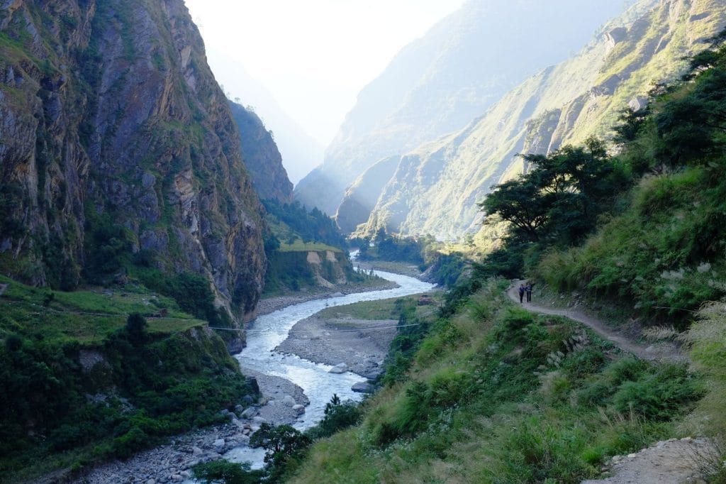 04_Breathtaking_view_of_a_river_cutting_through_a_lush_valley_in_the_Hima